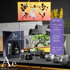ARWA Essential Reed Diffuser Set contents - 1 reusable ceramic pot 125ml, 1 reed diffuser oil 60ml, 6 premium black reed sticks, displayed on living room table