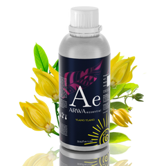ARWA Essential Ylang-Ylang Aroma Diffuser Oil 1 Litre silver bottle with white cap, yellow ylang-ylang flowers in background