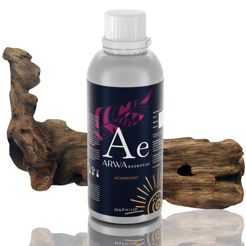 ARWA Essential Agarwood Oud Aroma Diffuser Oil 1 Litre silver bottle with white cap, natural agarwood driftwood in background