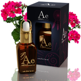 ARWA Essential Geranium Essential Oil 20ml amber glass dropper bottle with gold cap and packaging box, pink geranium flowers in background