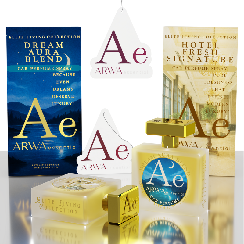 A perfume gift set from ARWA essential featuring two car perfume sprays in clear bottles with gold caps, two matching rectangular boxes, and two white hanging tags with the ARWA logo, all arranged on a reflective white surface.