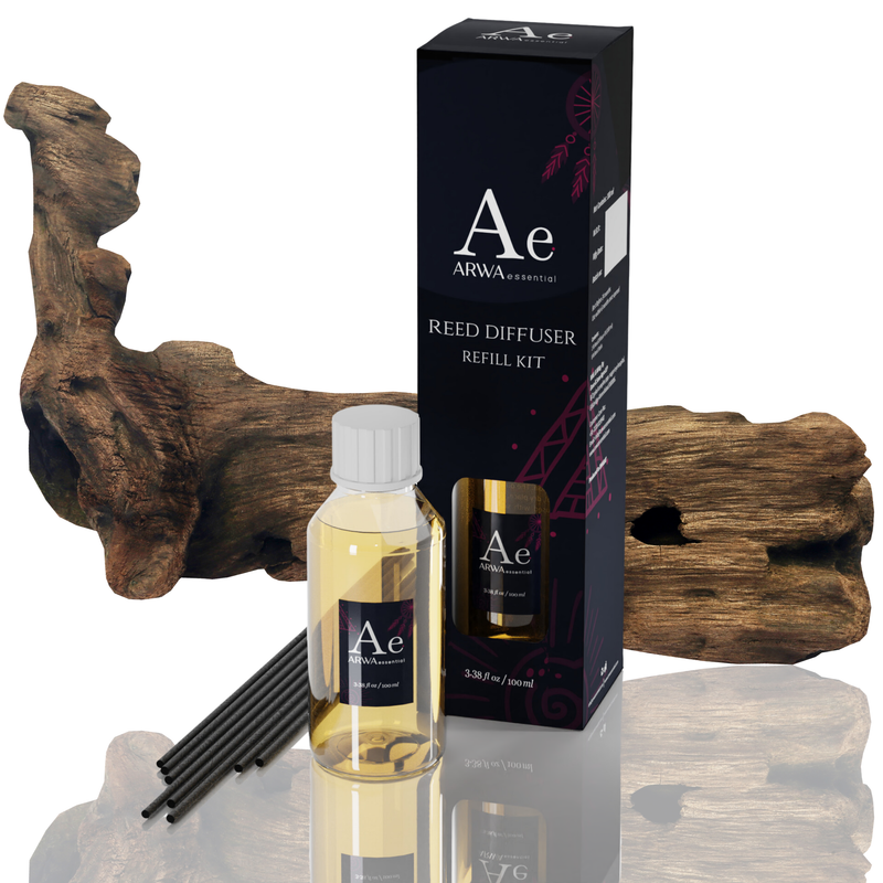 ARWA Essential Agarwood Oud Reed Diffuser Refill Kit - 100ml fragrance oil bottle with 8 premium black reed sticks and packaging box, natural agarwood driftwood in background