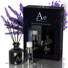 ARWA Essential French Lavender Reed Diffuser Set - black ceramic diffuser pot with reed sticks, fragrance oil bottle and refill bottle with packaging box, lavender flowers in background