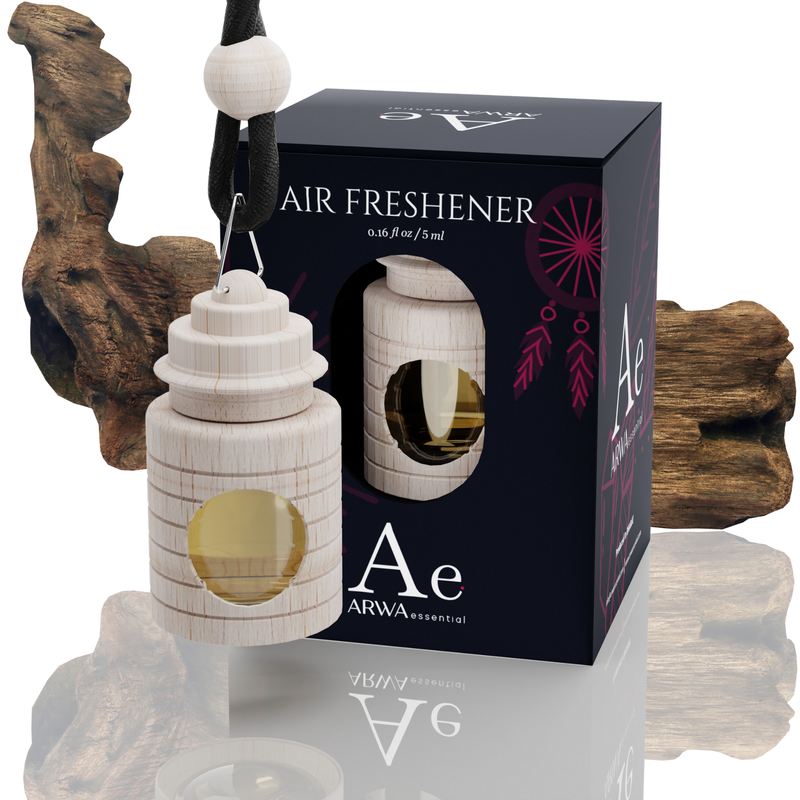 ARWA Essential Agarwood (Oud) Air Freshener car hanging perfume, 5ml wooden bottle with metal clip hanger and packaging box, driftwood in background